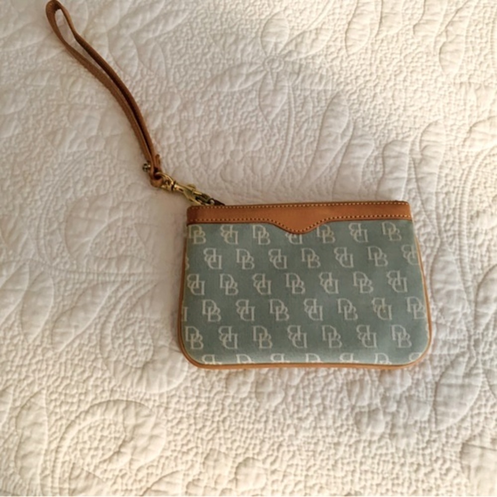 Dooney and Bourke signature logo, mint green signature wristlet wallet.